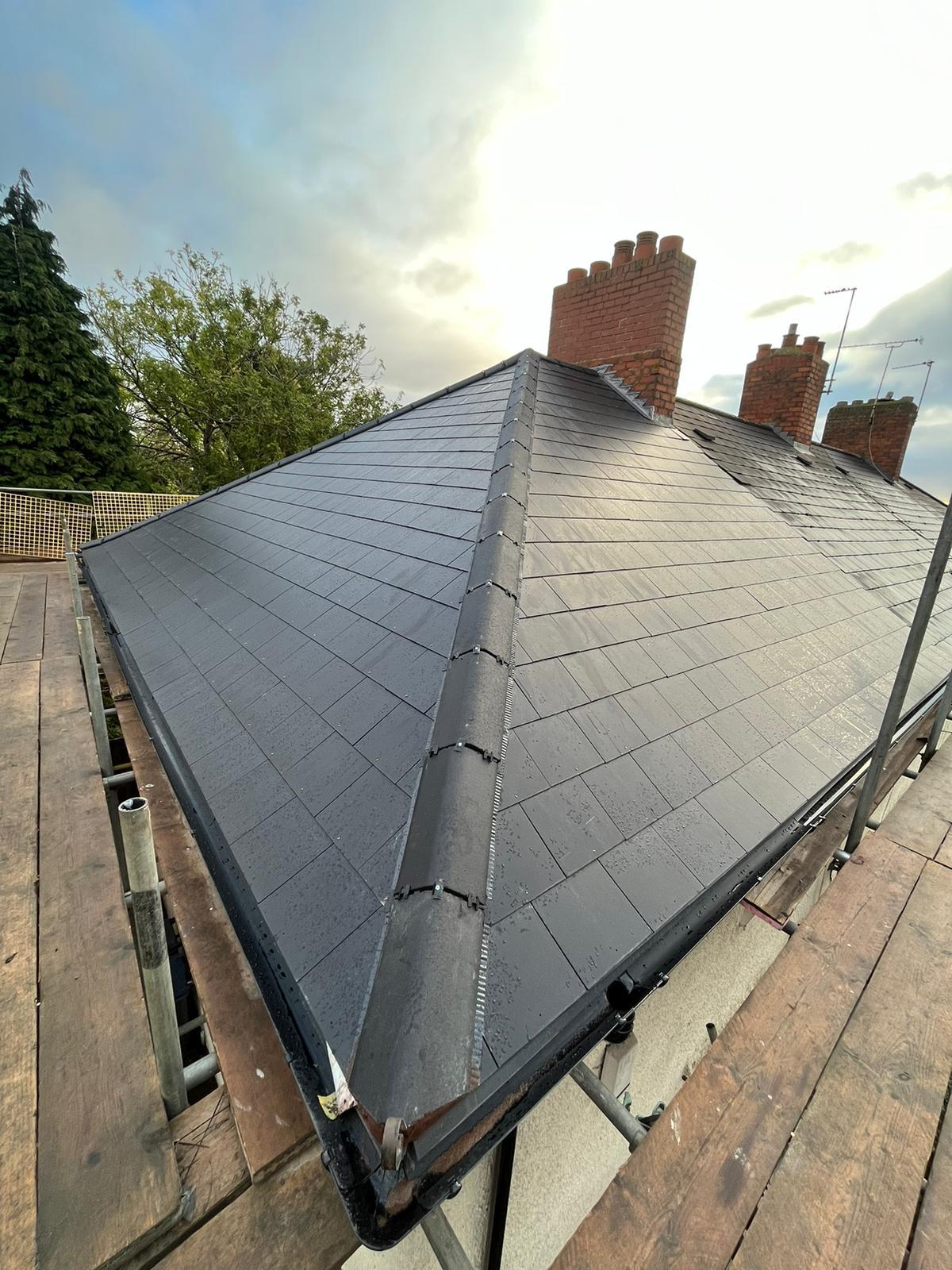 Completed natural slate hipped re-roof with brick chimney, Worcestershire