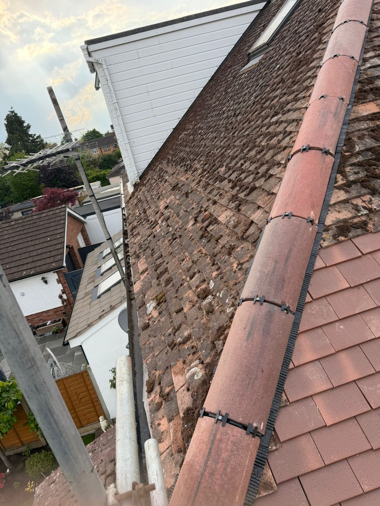 Ridge tile repair and re-bedding on an older plain tile roof